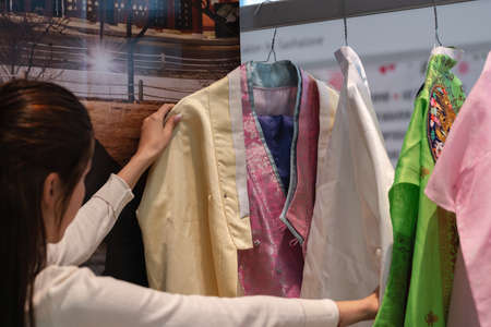 Traditional Korean women dress Hanbok vibrant colors for attire during traditional occasions: celebrations, festivals and ceremonies. Dress hanging on clothes hanger. Kamchatka, Russia - Oct 17, 2019のeditorial素材