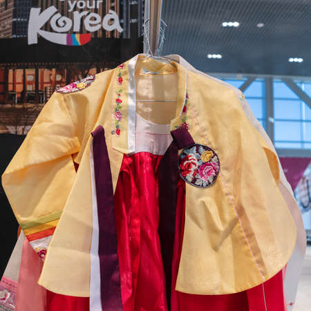 Hanbok - traditional Korean women dress vibrant colors for attire during traditional occasions as celebrations, festivals, ceremonies. Dress hanging on clothes hanger. Kamchatka, Russia - Oct 17, 2019のeditorial素材