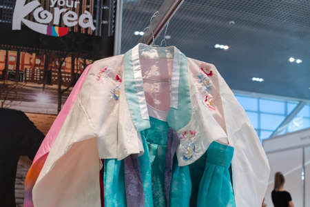 Hanbok - traditional Korean women dress vibrant colors for attire during traditional occasions: celebrations, festivals, ceremonies. Clothes hanging on clothes hanger. Kamchatka, Russia - Oct 17, 2019のeditorial素材