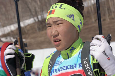 Portrait of Mongolian sportswoman biathlete Doljinsuren Munkhbat during Regional Junior biathlon competitions East of Cup. Petropavlovsk City, Kamchatka Peninsula, Russian Far East - April 14, 2019のeditorial素材