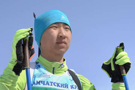 Portrait of Mongolian sportsman biathlete Batkhuyag Taivanbaatar during Regional Junior biathlon competitions East of Cup. Petropavlovsk City, Kamchatka Peninsula, Russian Far East - April 14, 2019のeditorial素材