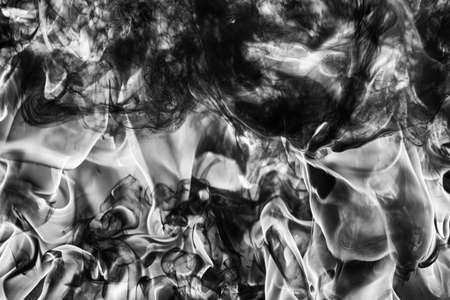 Dramatic Abstract plume of natural black smoke and white huge flame of strong fire, high temperature...