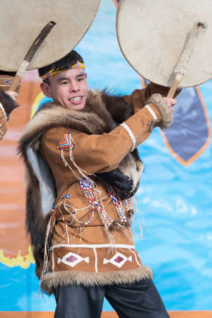 Male expression dancing with tambourine in tradition clothing indigenous inhabitants Kamchatka. Celebration Koryak national holiday Hololo Day of Seal. Kamchatka Peninsula, Russia - November 4, 2018のeditorial素材