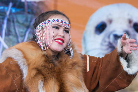 Female expression dancing in national clothing indigenous inhabitants Kamchatka Peninsula. Concert, celebration Koryak national holiday Day of Seal - Hololo. Kamchatka Territory, Russia - Nov 4, 2018.のeditorial素材