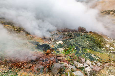 Mysterious view of volcanic landscape, aggressive hot spring, eruption fumarole, gas-steam activity...