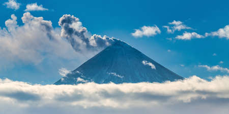 Beautiful volcano eruption, warning danger mount peak erupting ashes and volcanic gas from active crater.の写真素材
