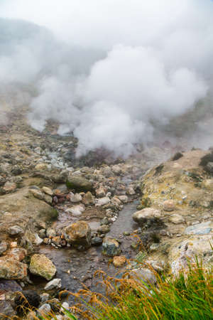 Scenery view of volcanic landscape, aggressive hot spring, gas-steam activity in crater of active...