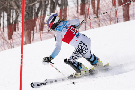 Mountain skier Kuznetsova Polina Murmansk Region skiing down. Russian Alpine Skiing Championship, International Ski Federation Championship, slalom. Kamchatka, Russian Federation - March 28, 2019のeditorial素材