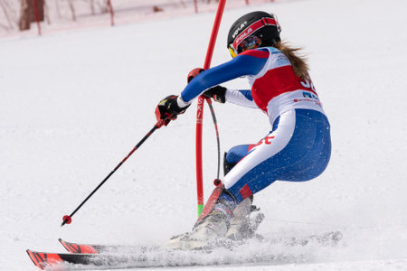 KAMCHATKA PENINSULA, RUSSIAN FEDERATION - MARCH 28, 2019: Mountain skier Ulyana Lendya Kamchatka Region. Russian Alpine Skiing Championship, International Ski Federation Championship, slalom.のeditorial素材