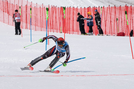 MOROZNAYA, KAMCHATKA PENINSULA, RUSSIA - MAR 28, 2019: Mount skier Sergey Maytakov Novosibirsk Region skiing finish line. Russian Alpine Skiing Cup, International Ski Federation Championship slalom.のeditorial素材
