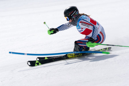 MOROZNAYA MOUNT, KAMCHATKA, RUSSIA - MARCH 29, 2019: Russian Alpine Skiing Cup International Ski Federation Championship slalom. Mountain skier Anna Shukhov Sakhalin Region skiing down mount slope.のeditorial素材