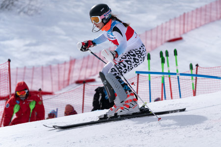MOROZNAYA MOUNT, KAMCHATKA PENINSULA, RUSSIA - MAR 29, 2019: Mount skier Naumova Alexandra Murmansk Region skiing down. Russian Alpine Skiing Cup, International Ski Federation Championship, slalom.のeditorial素材