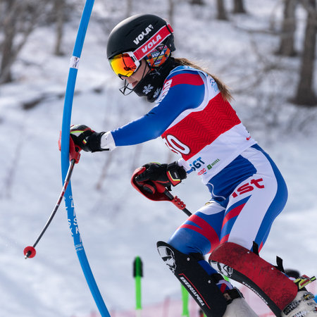 MOROZNAYA MOUNT, KAMCHATKA PENINSULA, RUSSIA - MAR 29, 2019: Mount skier Lendya Ulyana Kamchatka Region skiing down mount. Russian Alpine Skiing Cup, International Ski Federation Championship slalomのeditorial素材
