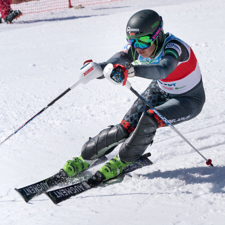 Sportswoman mountain skier Maria Shkanova Belarus skiing down mountain ski slope. Russian Federation Alpine Skiing Championship, parallel slalom. Kamchatka Peninsula, Russia - March 30, 2019のeditorial素材
