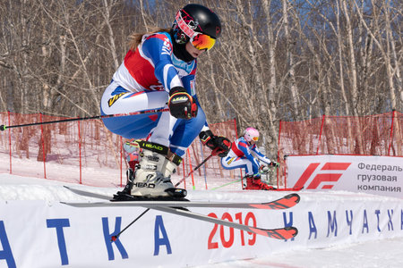 MOROZNAYA MOUNT, KAMCHATKA PENINSULA, RUSSIA - MARCH 30, 2019: Mountain skier Ulyana Lendya Kamchatka Region skiing down mount slope. Russian Federation Alpine Skiing Championship, parallel slalom.のeditorial素材