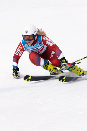Kamchatka mountain skier Rinata Abdulkayumova skiing down mount slope giant slalom. Russian Women Alpine Skiing Cup, International Ski Federation FIS Championship. Kamchatka, Russia - April 2, 2019のeditorial素材