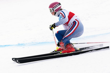 KAMCHATKA PENINSULA, RUSSIA - APRIL 2, 2019: International Ski Federation Championship, Russian Women s Alpine Skiing Cup, giant slalom. Mountain skier Dariya Kryukova Chelyabinsk skiing down mountのeditorial素材