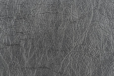 Dark gray color abstract unique faux leather pattern for background. Close-up top view photography of light black color surface level artificial leather material, background wrinkle textureの写真素材