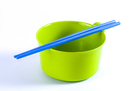 Colorful Bowls with the chopsticks on a white backgroundの写真素材