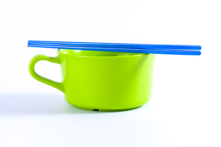 Colorful Bowls with the chopsticks on a white backgroundの写真素材