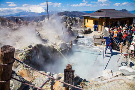Hakone,Japan - March 22 ,2014   Unidentified man  working for boil volcano egg at hakone mountain - Many people go to travel this place   They believe if you eat 1 egg you will increase  your life for 5 yearのeditorial素材