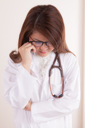 Female doctor in a white medical dressing gownの写真素材
