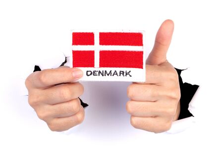 Women Hand Holding Denmark Flag isolated on whiteの写真素材