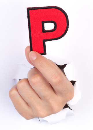 Women Hand Holding P Alphabet isolated on whiteの写真素材