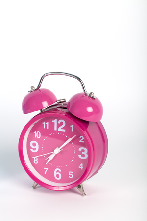 Vintage alarm clock isolated on white backgroundの写真素材