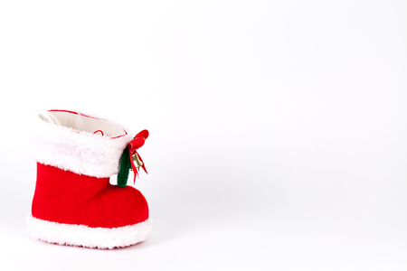 Red Santa's boot with copyspace isolated on white backgroundの写真素材