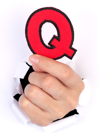 Women Hand Holding Q Alphabet isolated on whiteの写真素材