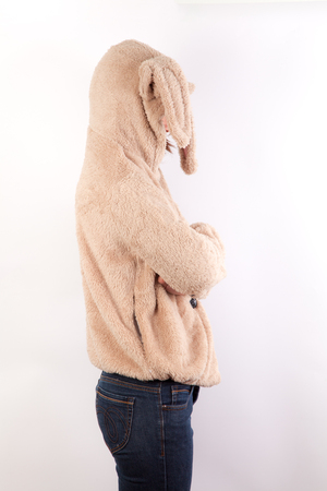 Attractive Young asian woman in Brown coat with rabbit hat,white backgroundの写真素材