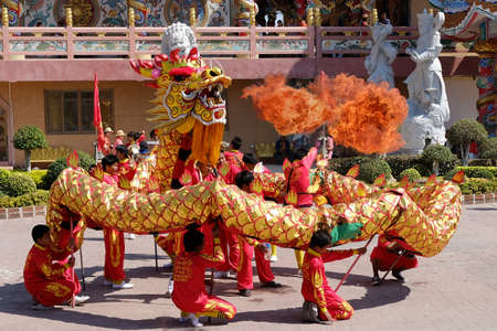 CHONBURI PROVINCE, THAILAND-February 1, 2014: The Golden Dragon dances and spurts out fire in Chinese temple. it was the Chinese New Year festival.のeditorial素材