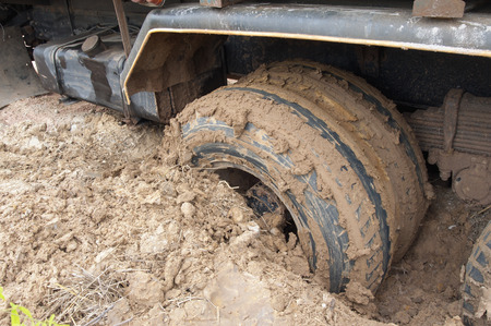 Truck tires down into the mud.