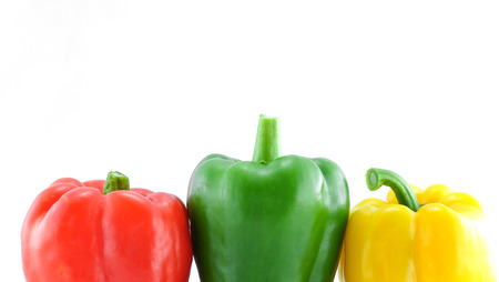 Yellow, red and green bell peppersの写真素材