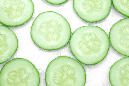 fresh chop cucumbers in the waterの写真素材