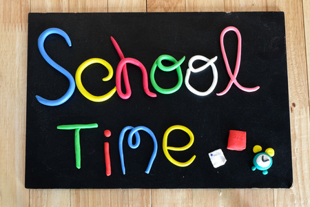 "school time" text made from color clay on blackboardの写真素材