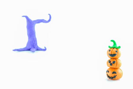 Clay Halloween pumpkin over white backgroundの写真素材