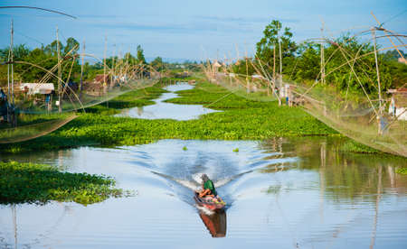 man on a motor boat. Fishing.の写真素材