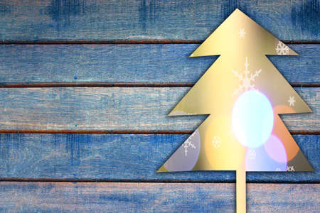 cristmas tree on wood backgroundの写真素材