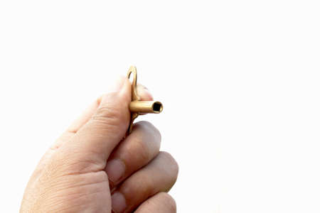 hand holding key on isolated on white backgroundの写真素材