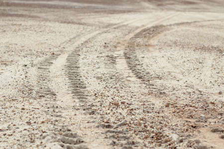 4 wheel tracks detail on groundの写真素材