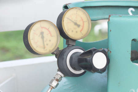 Closeup of a pressure meter on a machineの写真素材