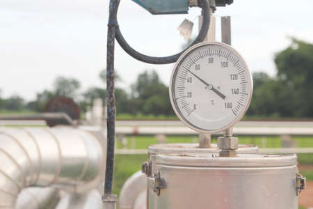 Closeup of a pressure meter on a machineの写真素材