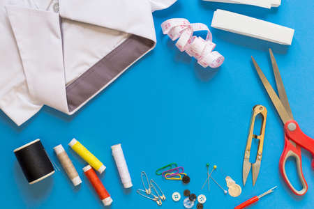 Sewing accessories on blue backgroundの写真素材