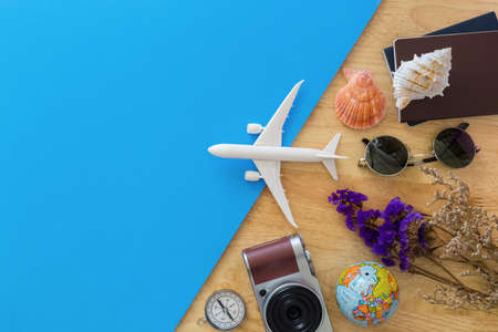 Top view of beach summer accessories with copy space. Lay flat holiday fashion background on backgroundの写真素材