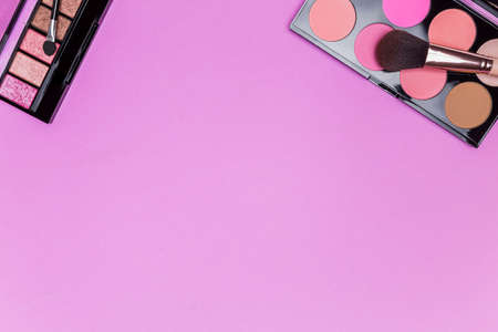 set of professional decorative cosmetics, makeup tools and accessory on pink color background. beauty, fashion, party and shopping concept. flat lay composition, top viewの写真素材