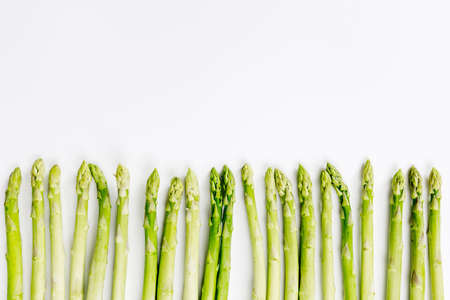 Fresh green asparagus on white backgroundの写真素材