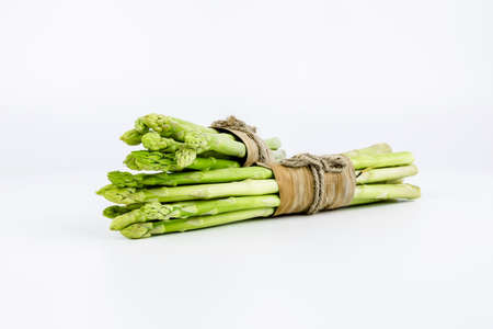 Fresh green asparagus on white backgroundの写真素材