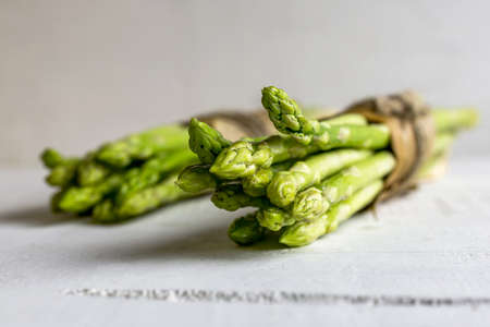 Fresh green asparagus on wooden backgroundの写真素材